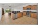 Modern kitchen featuring stainless steel appliances and wood cabinets at 26841 Bella Vista Dr, Howey In The Hills, FL 34737