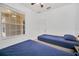 Bedroom with two twin beds, large window and view of patio at 26841 Bella Vista Dr, Howey In The Hills, FL 34737