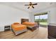 Bright bedroom with two twin beds, ample natural light, and access to a patio at 26841 Bella Vista Dr, Howey In The Hills, FL 34737