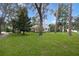 Charming house with a spacious front yard and mature trees at 731 Midget Dr, Winter Park, FL 32789