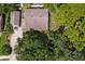 Aerial view of a house and surrounding trees at 731 Midget Dr, Winter Park, FL 32789
