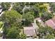 House nestled among trees near a pond at 731 Midget Dr, Winter Park, FL 32789