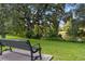 Park bench overlooking a pond and lush greenery at 731 Midget Dr, Winter Park, FL 32789