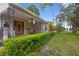 House exterior with a porch and lush landscaping at 731 Midget Dr, Winter Park, FL 32789