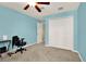 Light blue bedroom with large closet and ceiling fan at 5209 Villa Rosa Ave, Saint Cloud, FL 34771