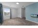 Upstairs bedroom with neutral decor and large window at 5209 Villa Rosa Ave, Saint Cloud, FL 34771