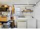 Laundry room with washer, dryer, and storage shelves at 610 S Laurel Ave, Sanford, FL 32771