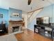 Living room with fireplace, hardwood floors, and built-in shelving at 610 S Laurel Ave, Sanford, FL 32771