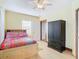 Bedroom with double bed, ceiling fan, and ample closet space at 610 S Laurel Ave, Sanford, FL 32771