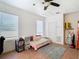Cozy bedroom with twin bed, window blinds, and tiled floors at 610 S Laurel Ave, Sanford, FL 32771