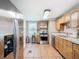 Modern kitchen with stainless steel appliances and wood cabinets at 610 S Laurel Ave, Sanford, FL 32771