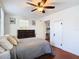 Bright bedroom with a dresser, double bed, and ceiling fan at 610 S Laurel Ave, Sanford, FL 32771