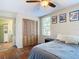 Bedroom with double bed, ceiling fan and built-in closet at 610 S Laurel Ave, Sanford, FL 32771