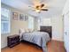 Bedroom with double bed, dresser, and hardwood floors at 610 S Laurel Ave, Sanford, FL 32771