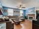 Spacious living room featuring a comfortable sectional sofa and hardwood floors at 610 S Laurel Ave, Sanford, FL 32771