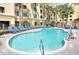 Resort-style pool with plenty of lounge chairs at 7601 Canada Ave # 605, Orlando, FL 32819