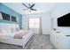 Main bedroom with king-size bed, TV, and access to a balcony at 951 Splash Shot Pl # 0, Davenport, FL 33896