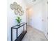 Bright entryway with contemporary mirror and console table at 951 Splash Shot Pl # 0, Davenport, FL 33896