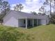 Single-story home with covered patio and spacious backyard at 6979 Big Bend Dr, St Cloud, FL 34771
