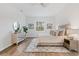 Main bedroom with king-size bed, plenty of natural light, and wood-look flooring at 6979 Big Bend Dr, St Cloud, FL 34771