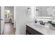 Bathroom with vanity, illuminated mirror, and view into bedroom at 6979 Big Bend Dr, St Cloud, FL 34771