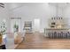 Modern kitchen with island and high ceilings, open to living area at 6979 Big Bend Dr, St Cloud, FL 34771