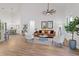 Open concept living room with high ceilings and hardwood floors at 6979 Big Bend Dr, St Cloud, FL 34771