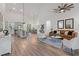 Open living room with high ceilings and hardwood floors at 6979 Big Bend Dr, St Cloud, FL 34771