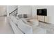 Open living room showcasing a sectional sofa, a coffee table, and a large TV at 10951 Citron Oaks Dr, Orlando, FL 32836