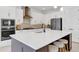 Bright kitchen featuring white cabinets, a sizable island, and top-of-the-line appliances at 10951 Citron Oaks Dr, Orlando, FL 32836