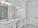 Bathroom with double vanity and large mirror at 10951 Citron Oaks Dr, Orlando, FL 32836