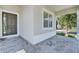 Front porch with brick flooring and view of the neighborhood at 10951 Citron Oaks Dr, Orlando, FL 32836