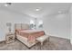 Main bedroom with beige bedding and nightstands at 10951 Citron Oaks Dr, Orlando, FL 32836