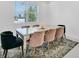 Elegant dining room featuring a glass-top table and six chairs at 10951 Citron Oaks Dr, Orlando, FL 32836
