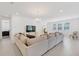 Spacious living room featuring a large sectional sofa and ample natural light at 10951 Citron Oaks Dr, Orlando, FL 32836