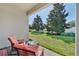 Relaxing patio with wicker chairs and view of the backyard at 10951 Citron Oaks Dr, Orlando, FL 32836