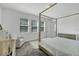 Main bedroom with canopy bed, dresser, and crib at 10951 Citron Oaks Dr, Orlando, FL 32836