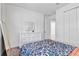 Bedroom with full-size bed and floral bedding at 10951 Citron Oaks Dr, Orlando, FL 32836
