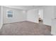 Spacious bonus room with carpet and view to another room at 10951 Citron Oaks Dr, Orlando, FL 32836