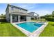 Spacious backyard oasis with a refreshing pool and spa at 7443 Marker Ave, Kissimmee, FL 34747