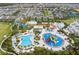 Aerial view of a community with pools, waterpark, and recreational areas at 7443 Marker Ave, Kissimmee, FL 34747