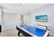 Fun game room featuring air hockey table and large TV at 7443 Marker Ave, Kissimmee, FL 34747