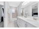 Double vanity bathroom with a bathtub and shower at 7443 Marker Ave, Kissimmee, FL 34747