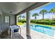 Relaxing pool and spa with covered patio and outdoor dining table at 7443 Marker Ave, Kissimmee, FL 34747