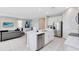 Spacious kitchen with island, stainless steel appliances, and marble countertops at 7443 Marker Ave, Kissimmee, FL 34747