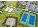 Aerial view of tennis courts, basketball court, and volleyball courts at 7443 Marker Ave, Kissimmee, FL 34747