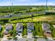 Community overview featuring several two-story houses and lush landscaping at 7443 Marker Ave, Kissimmee, FL 34747