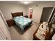 Spacious bedroom with a queen-size bed and en-suite bathroom at 5587 Devonbriar Way # 105, Orlando, FL 32822