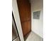 Well-lit pantry with ample wood cabinets and tile flooring at 5587 Devonbriar Way # 105, Orlando, FL 32822