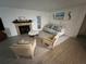 Spacious living room with fireplace and tile flooring at 5587 Devonbriar Way # 105, Orlando, FL 32822